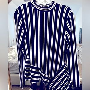 Black and white striped shirt with fabric detail on bottom - like new.